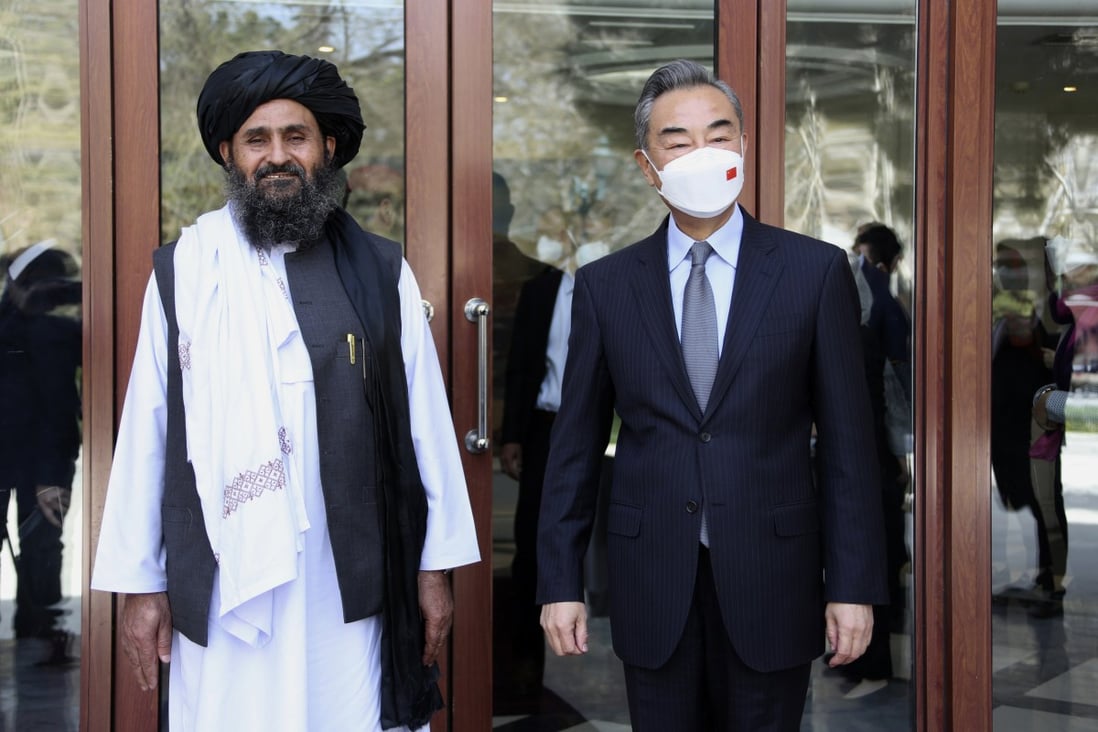 Chinese Foreign Minister Wang Yi (right) meets with  Mullah Abdul Ghani Baradar, the acting deputy prime minister of the Afghan Taliban’s government, in Kabul on March 24. A US advisory panel on China was told on Thursday that despite Beijing’s ambitions to boost its regional influence, it has confronted rising resistance from extremists. Photo: Xinhua via AP