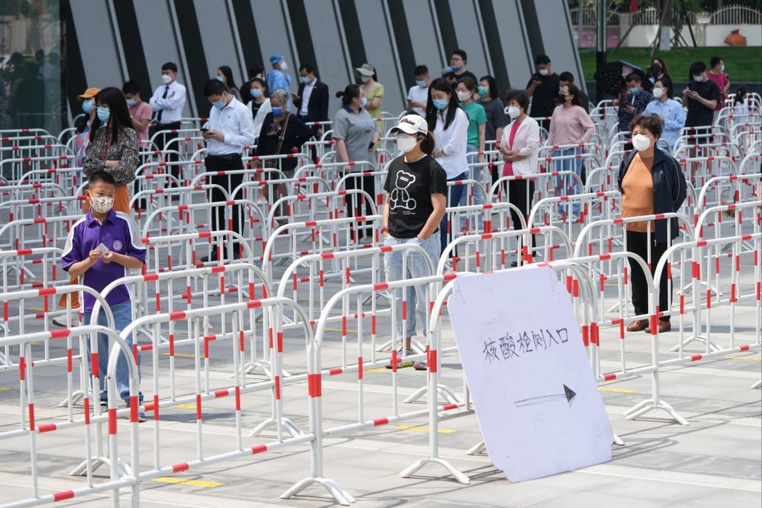 People line up to take a nucleic acid test in Chaoyang district in Beijing. Photo: Xinhua
