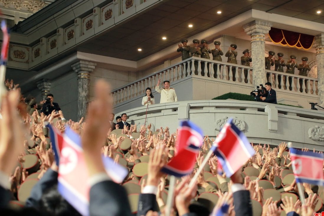 North Korean leader Kim Jong-un and his wife wave to the crowds at the April 25 military parade. At the time, North Korea still had yet to report a single Covid-19 case. Photo: Korean Central News Agency via Reuters