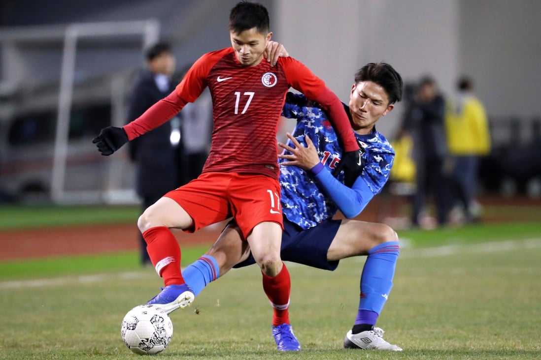 Chan Siu-kwan of Hong Kong competes against Japan’s Tsuyoshi Watanabe at the 2019 EAFF E-1 Football Championship in Busan. Photo: Reuters