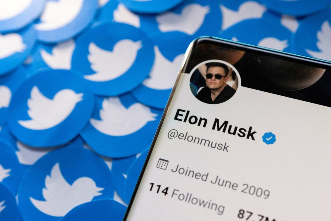 Elon Musk’s Twitter profile seen on a smartphone placed on printed Twitter logos in this picture illustration taken April 28. Photo: Reuters