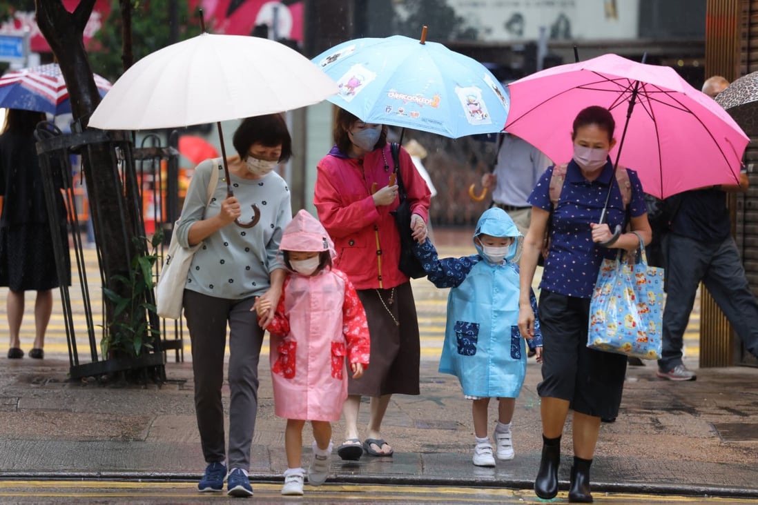 People walk in Causeway Bay during rainy weather on May 11. Photo: Nora Tam