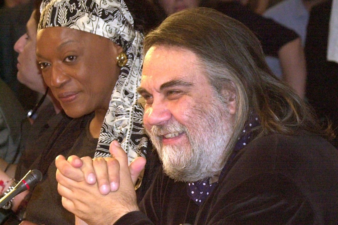 Composer Vangelis (right) answers a question during a press conference in Athens in June 2001. Photo: AP