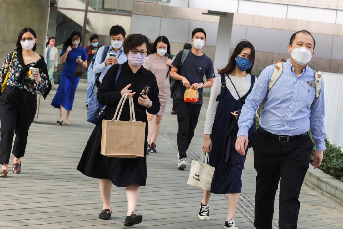 Civil servants head to work at the Central Government Offices in Tamar. Photo: Nora Tam