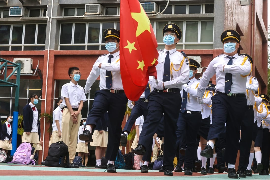 A flag-raising ceremony at Gertrude Simon Lutheran College in Yuen Long on National Security Education Day on April 15, 2021. Photo: K. Y. Cheng
