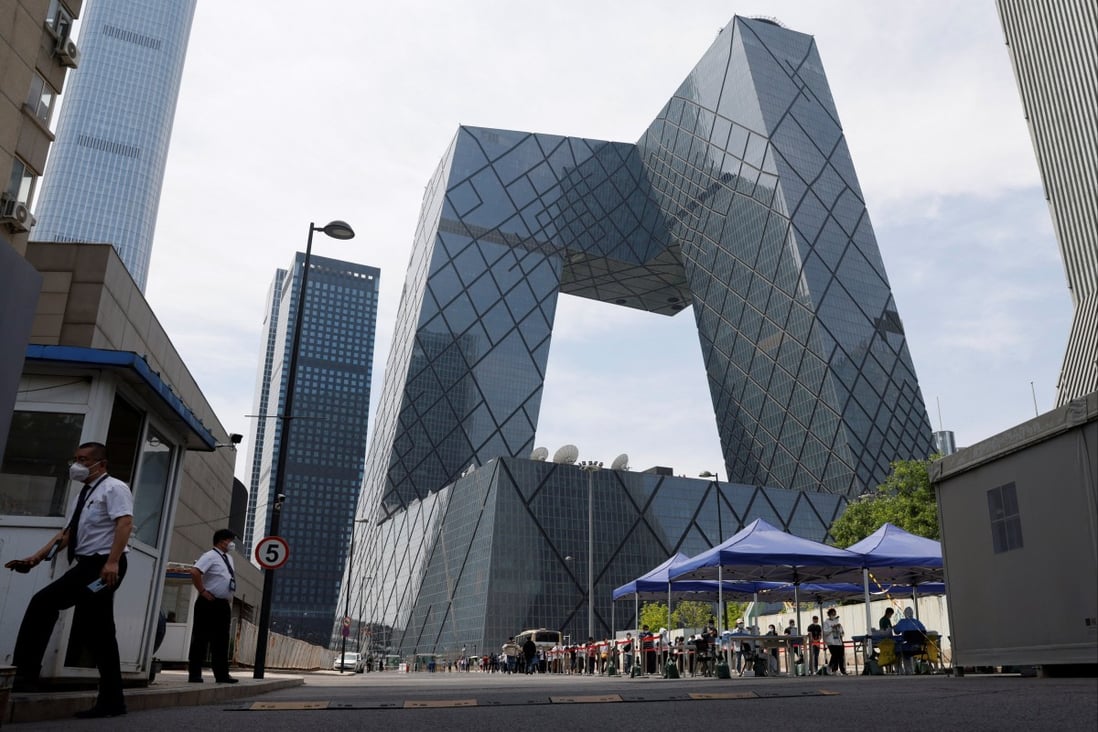 People line up to get tested at a makeshift nucleic acid testing site outside China Central Television (CCTV) headquarters, amid a Covid-19 outbreak in Beijing, on May 18. Photo: Reuters
