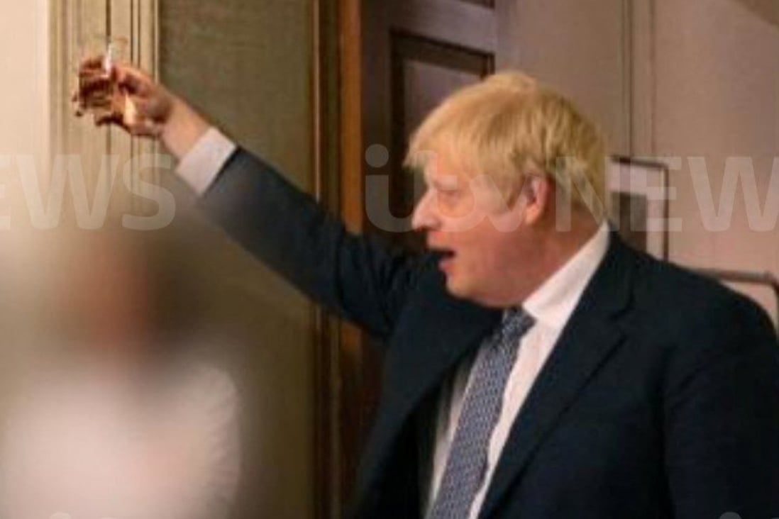 British Prime Minister Boris Johnson raises a glass during a party at Downing Street in an image said to be taken in November 2020, amid the coronavirus pandemic. Photo:  ITV News via Reuters