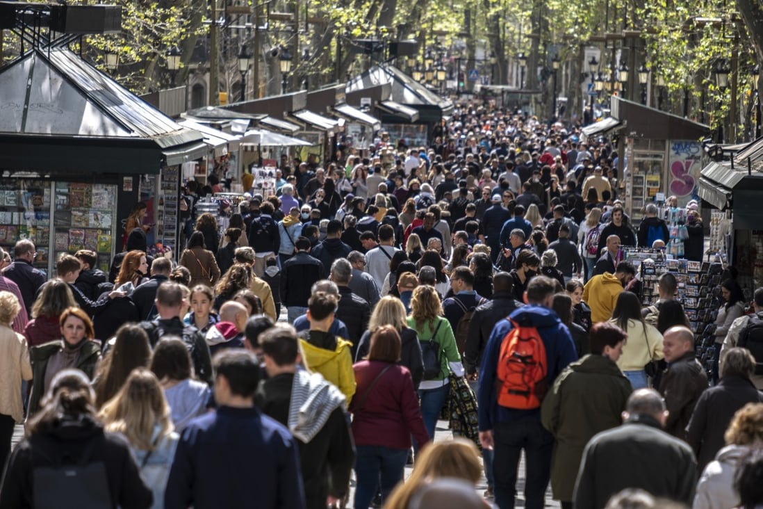 Is this “revenge travel”? People stroll down the Ramblas in Barcelona at the beginning of the 2022 Easter holidays as the city sees full tourist occupation after two years of mobility restrictions due to the Covid-19 pandemic. Photo: SOPA Images / LightRocket via Getty Images