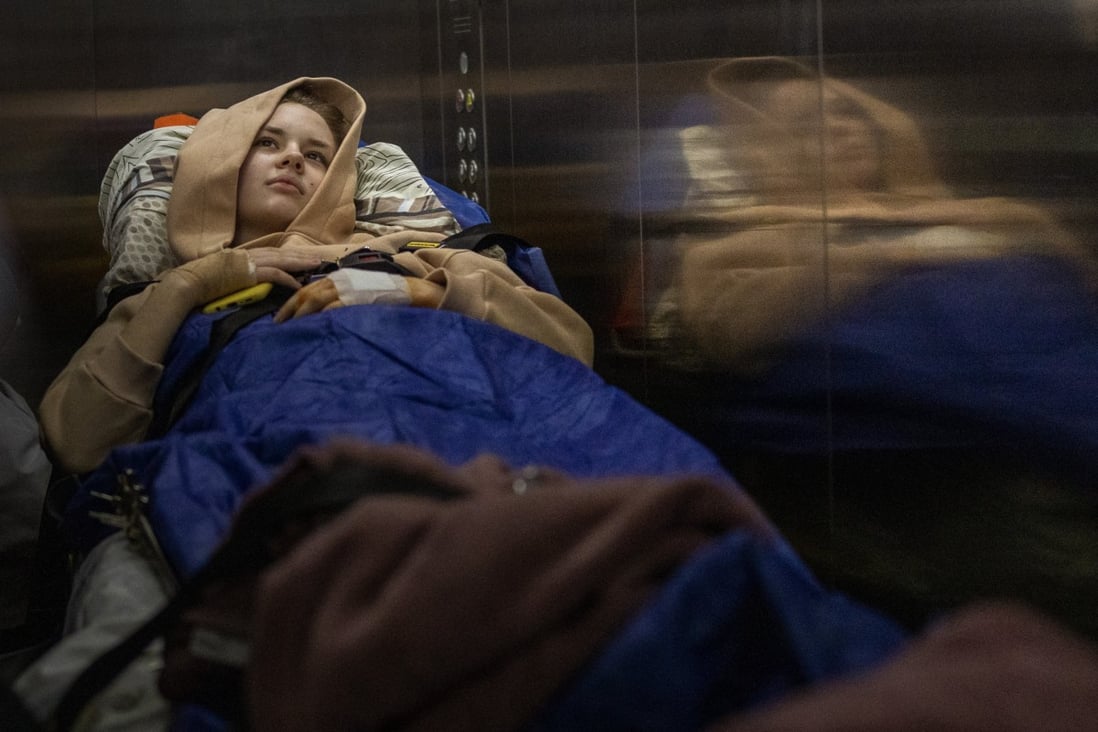 Nastia Kuzik, 21, lies on a stretcher in a hospital elevator in Kyiv, Ukraine on May 5. Photo: AP