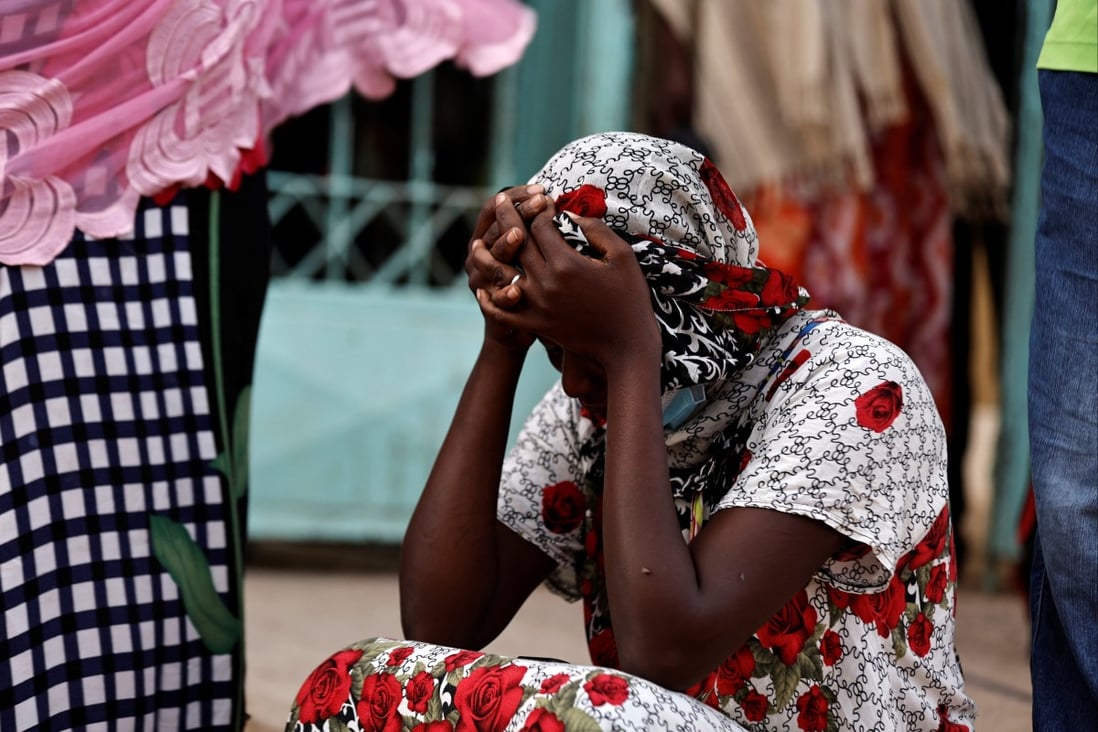 Kaba, a mother of a 10-day-old baby, reacts as she sits outside the hospital where 11 newborns died in a hospital fire in Tivaouane, Senegal. Photo: Reuters