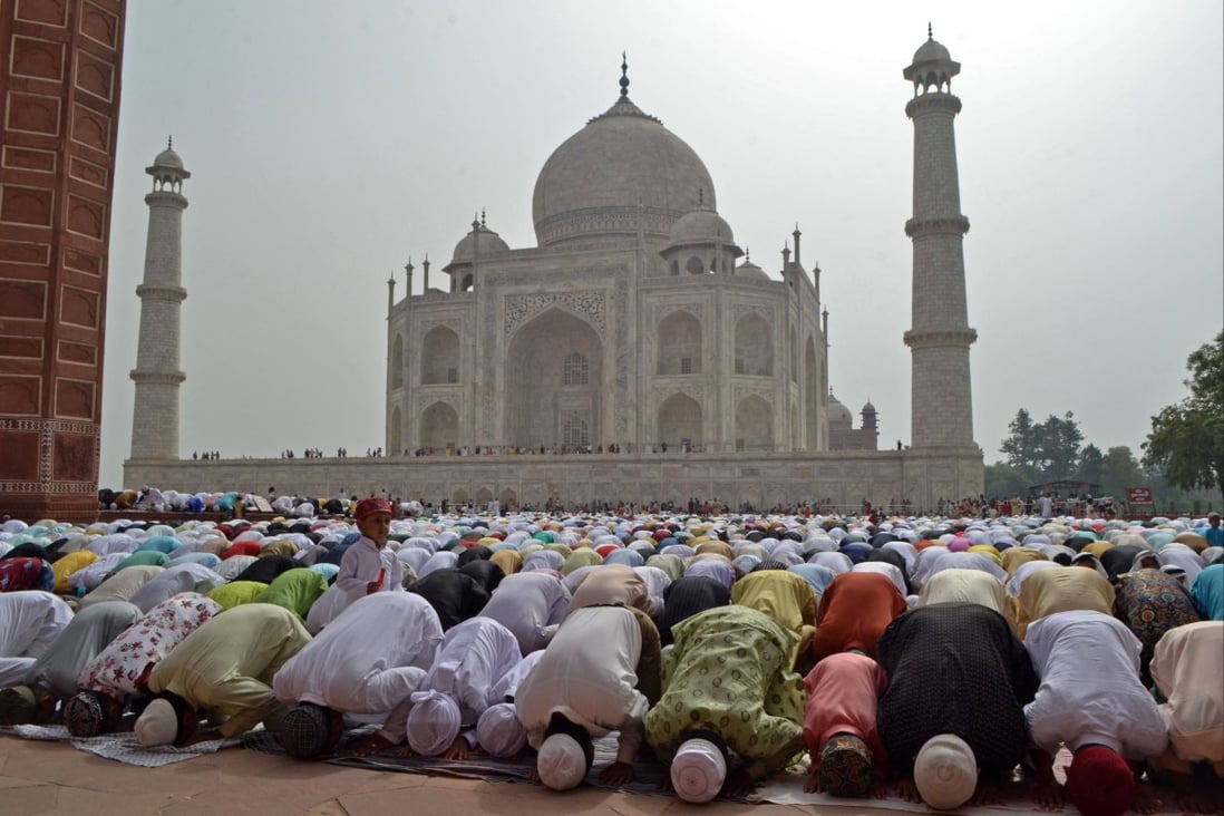 Muslims offer a special morning prayer inside the Taj Mahal complex earlier this month to mark the start of Eid al-Fitr festival, which follows the fasting month of Ramadan. AFP
