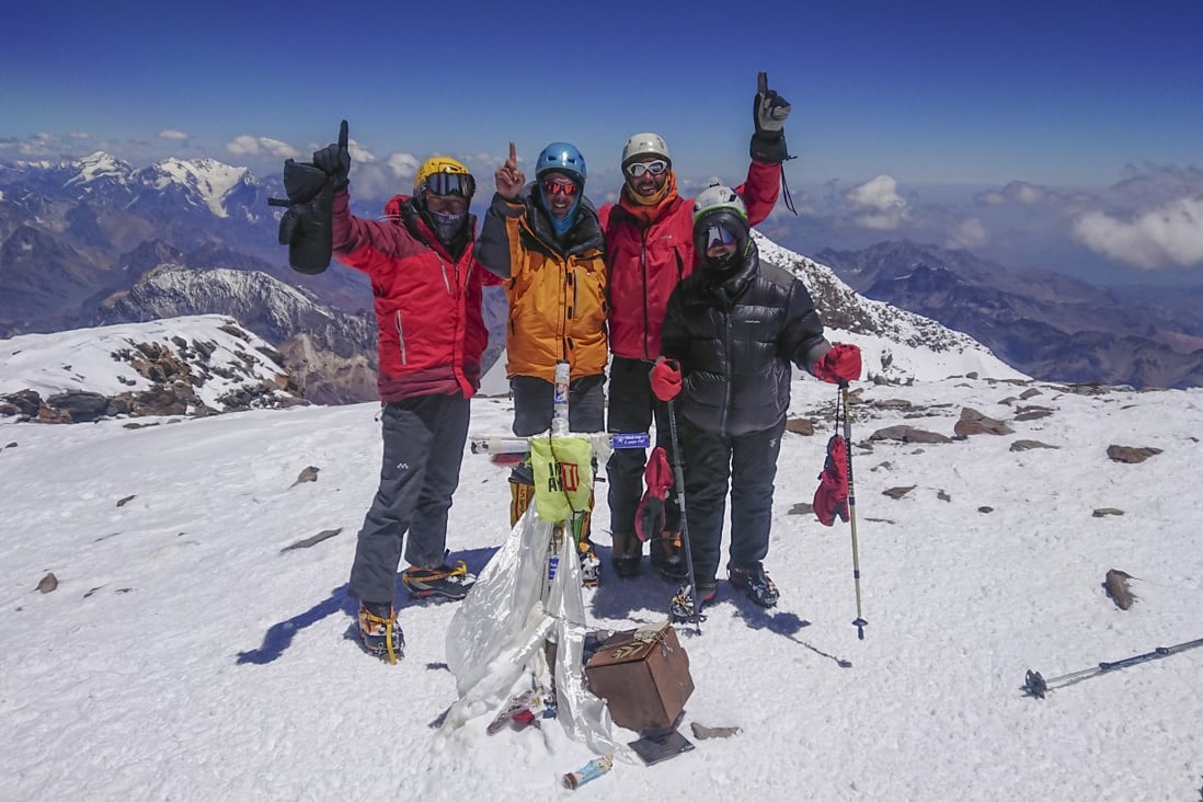 A group celebrate reaching the summit of Mount Aconcagua. Photo: Carina Dayondon