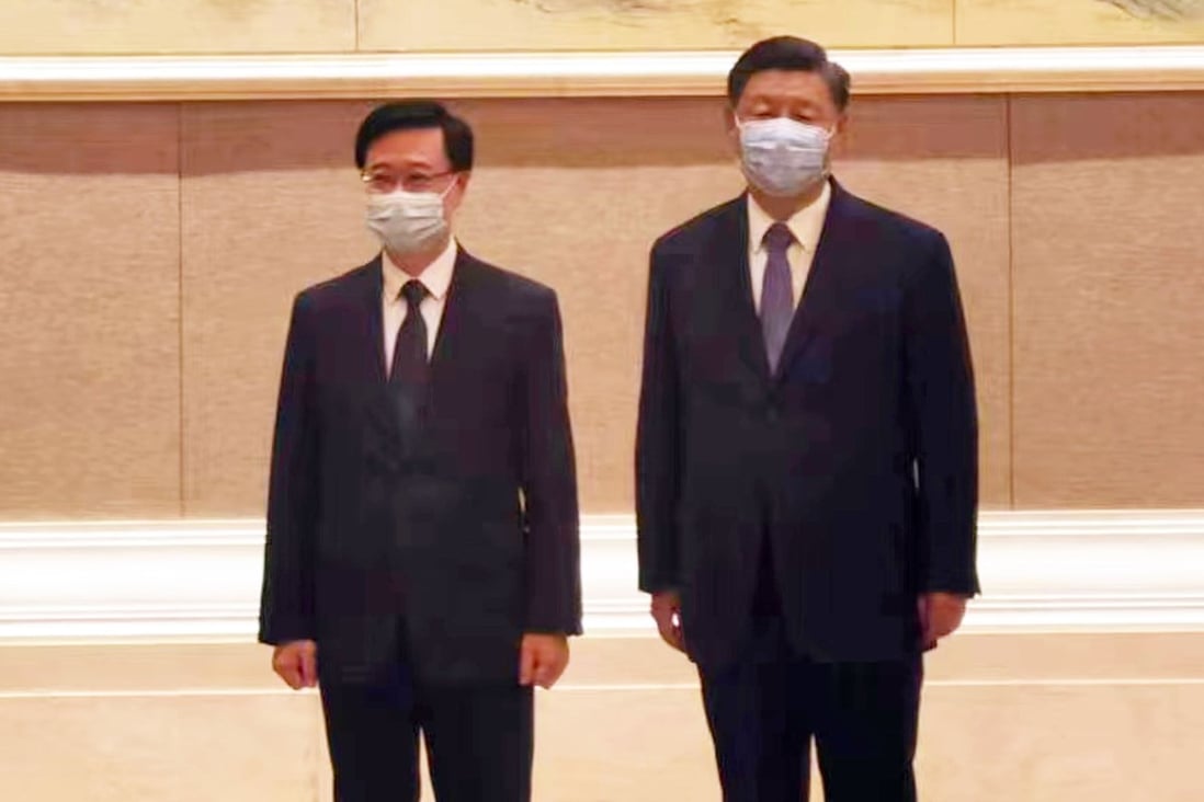 Chinese President Xi Jinping with Hong Kong Chief Executive-elect John Lee in Beijing. Photo: Handout