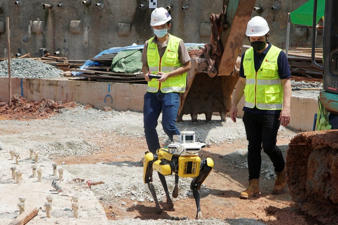 A robot dog is used on a construction site to an run autonomous survey. Robots are helping with a manpower shortage in Singapore. Photo: Reuters
