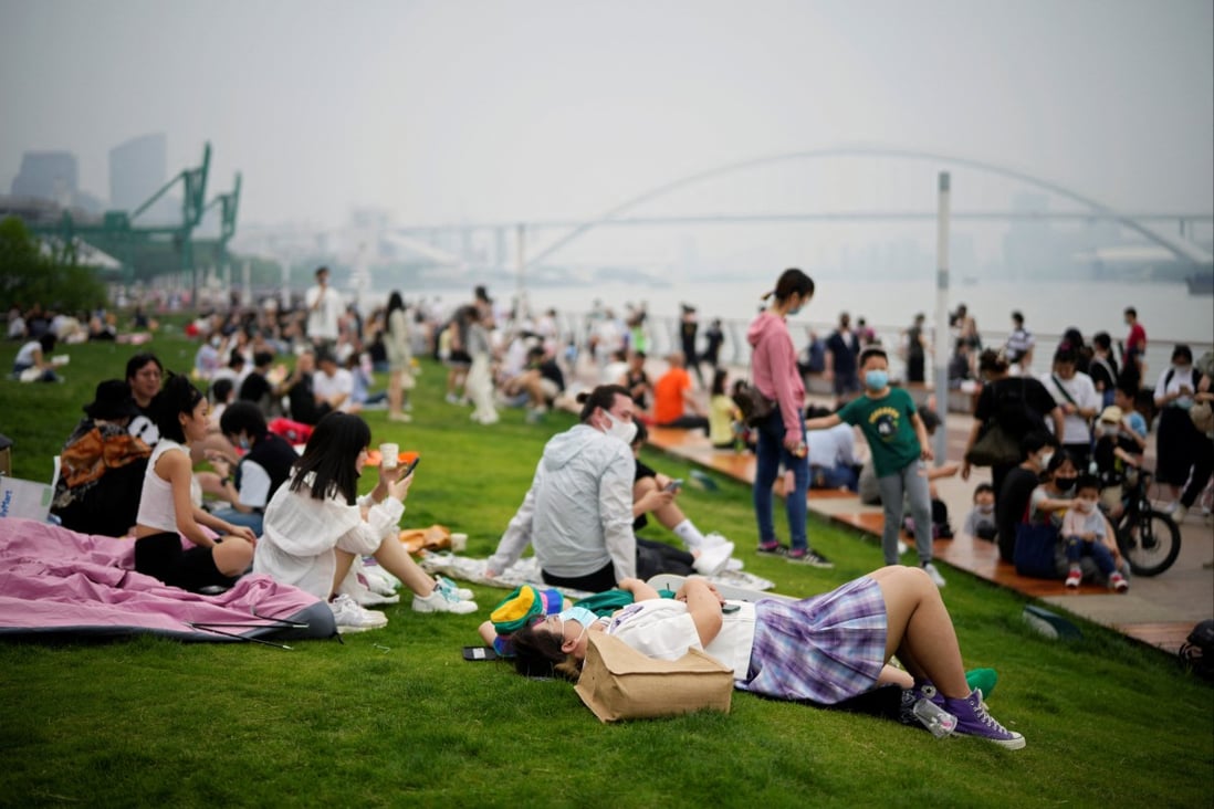 People spend time at a riverside park in Shanghai on Wednesday after the city’s long Covid-19 lockdown was lifted. Photo: Reuters