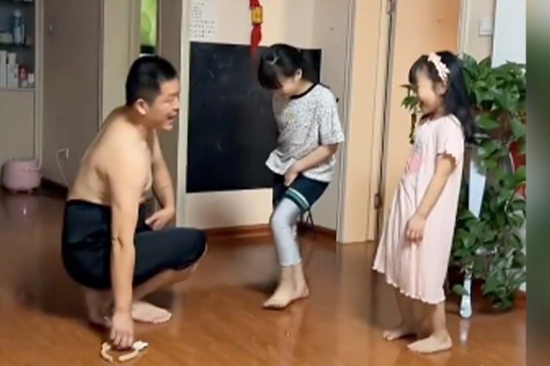 A Chinese father wears a skirt to teach his daughters how to avoid upskirt photos and wins praise on the internet. Photo: Handout