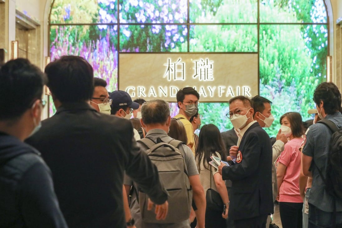 Potential buyers wait in line to buy flats at Sino Land’s Grand Mayfair residential development in Yuen Long, on May 20, 2022. Photo: Xiaomei Chen