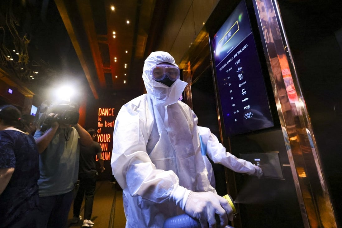 Cleaners disinfect Zentral club in the California Tower in Hong Kong’s Lan Kwai Fong area, following an outbreak of Covid-19 cases. Photo: Dickson Lee