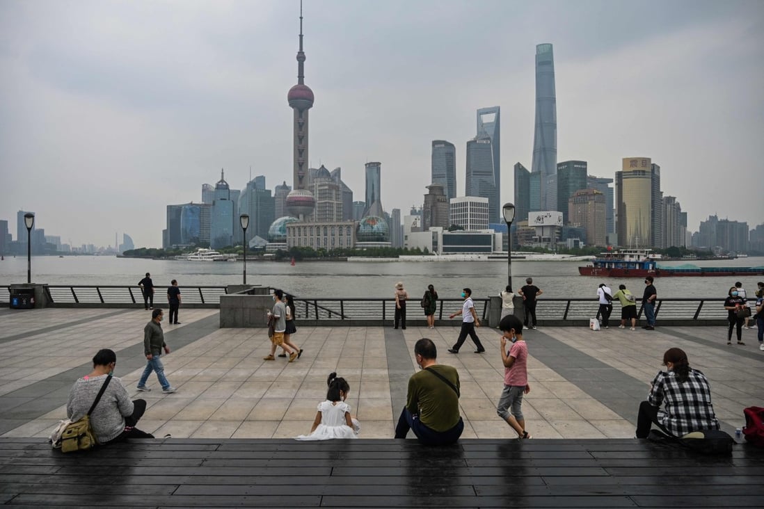 People gather on the Bund along the Huangpu River in Shanghai on June 1, following the easing of Covid-19 restrictions in the city after a two-month lockdown. Photo: AFP