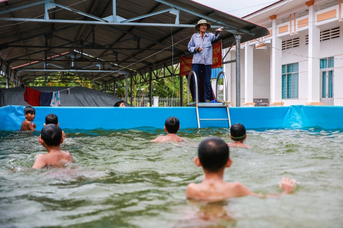 Sau Thia teaches children swimming in a makeshift pool in Vietnam’s Dong Thap province. Photo: Giang Pham