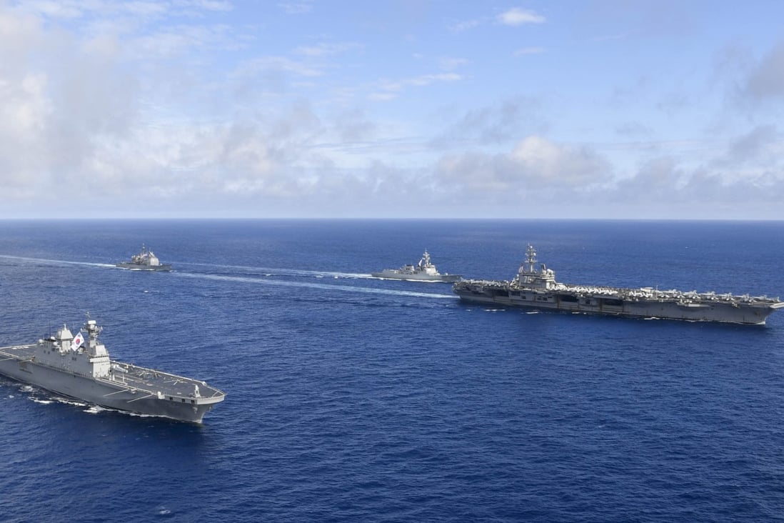 The US nuclear-powered aircraft carrier USS Ronald Reagan, right, and South Korea’s landing platform helicopter ship Marado during a joint military exercise. Photo: AP
