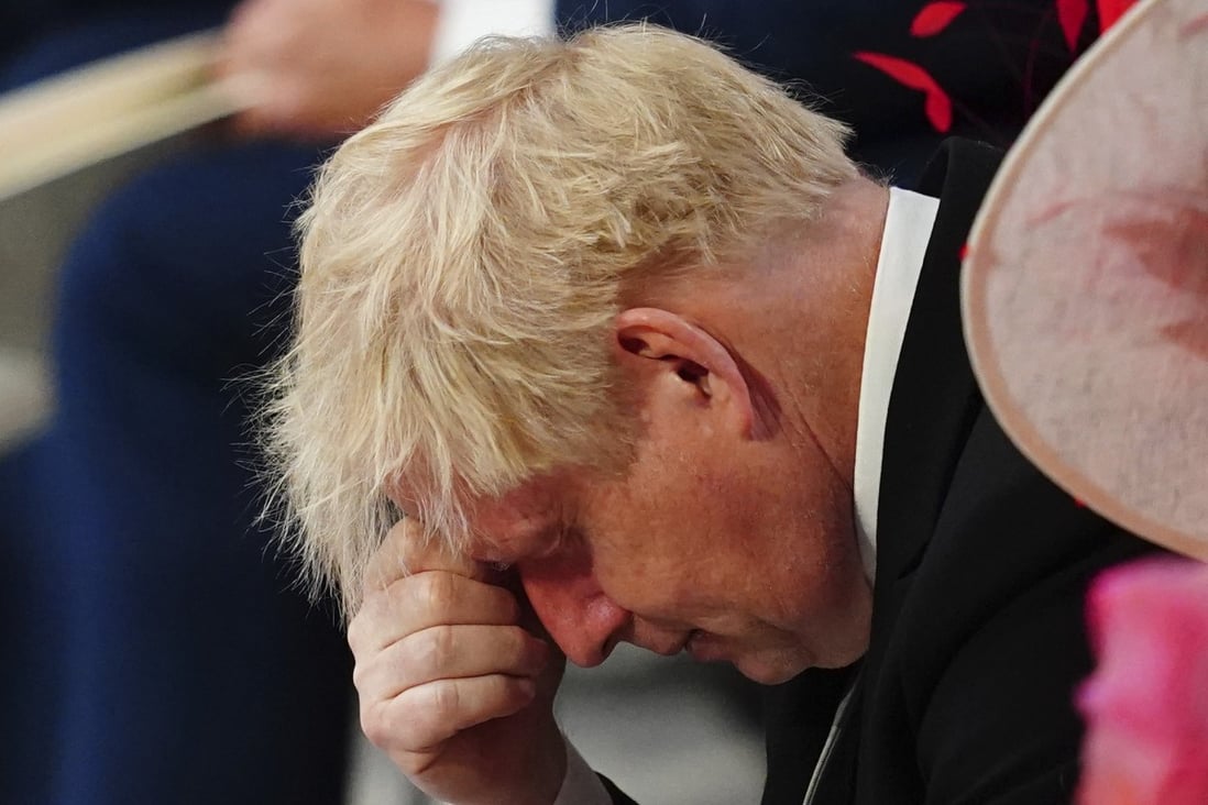 Britain’s Prime Minister Boris Johnson was jeered by the public when he arrived at a service of thanksgiving for Queen Elizabeth on Friday. Photo: AP