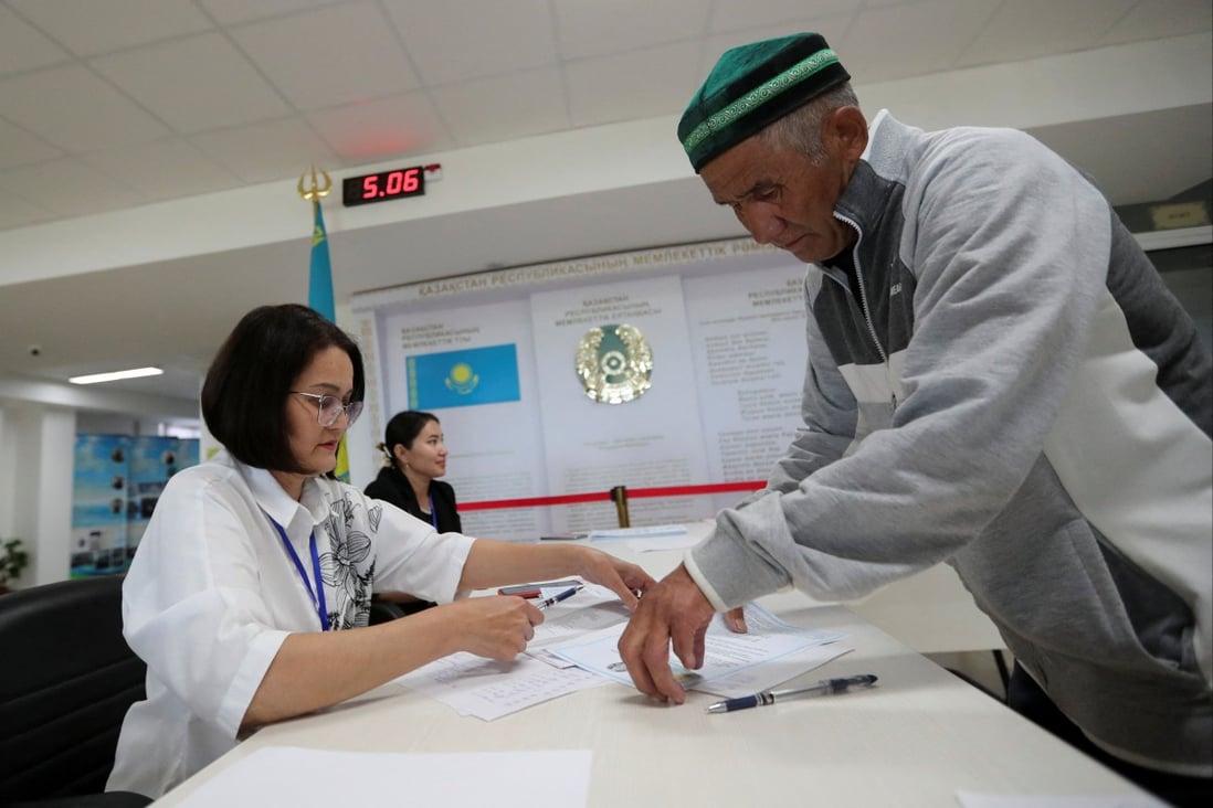 A man prepares to cast his ballot at a polling station during a constitutional referendum, in Koyandy, Akmola region, Kazakhstan, on Sunday. Photo: Reuters