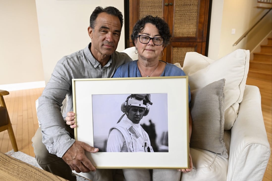 Derek and Suzi Alkonis with a photo of their son Lieutenant Ridge Alkonis who faces a potential three-year prison sentence for a car crash that killed two people. Photo: AP
