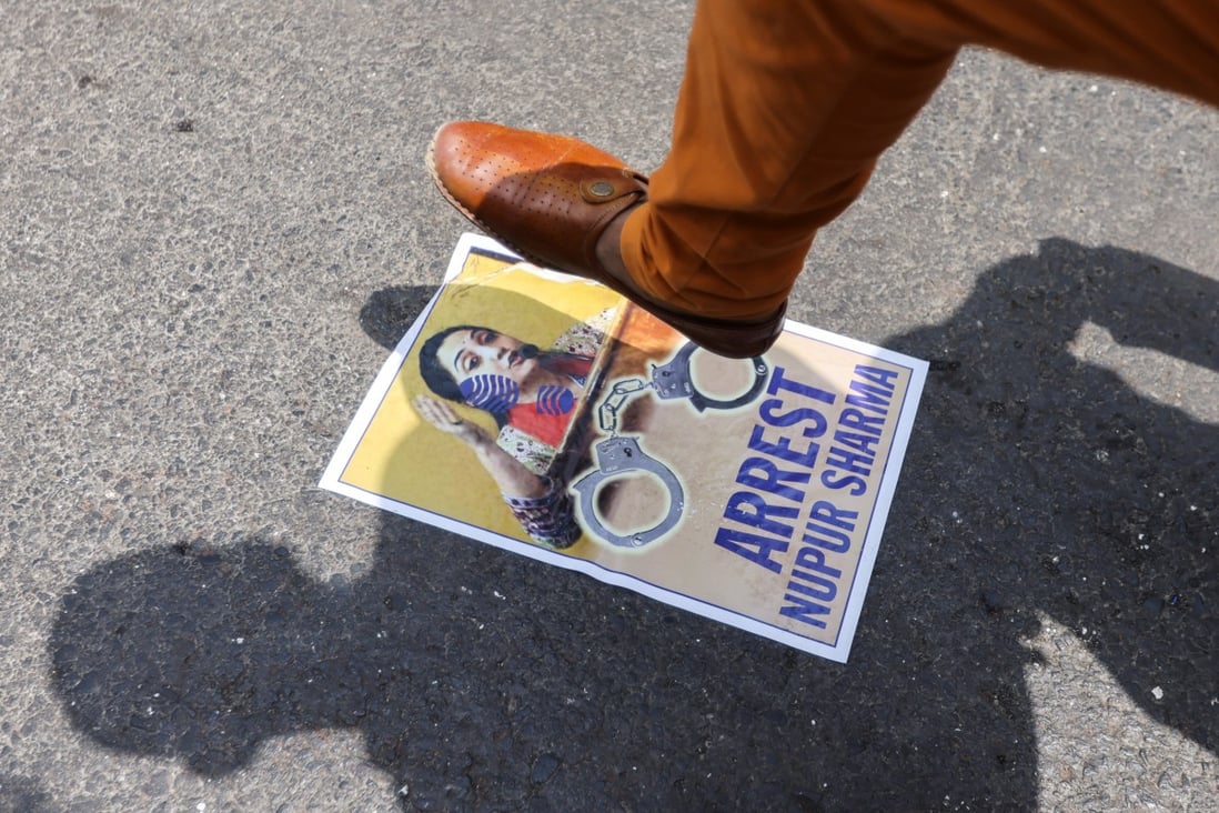 A demonstrator in India stamps on a poster of Bharatiya Janata Party (BJP) member Nupur Sharma on Monday after her comments last week about Prophet Mohammed. Photo: Reuters