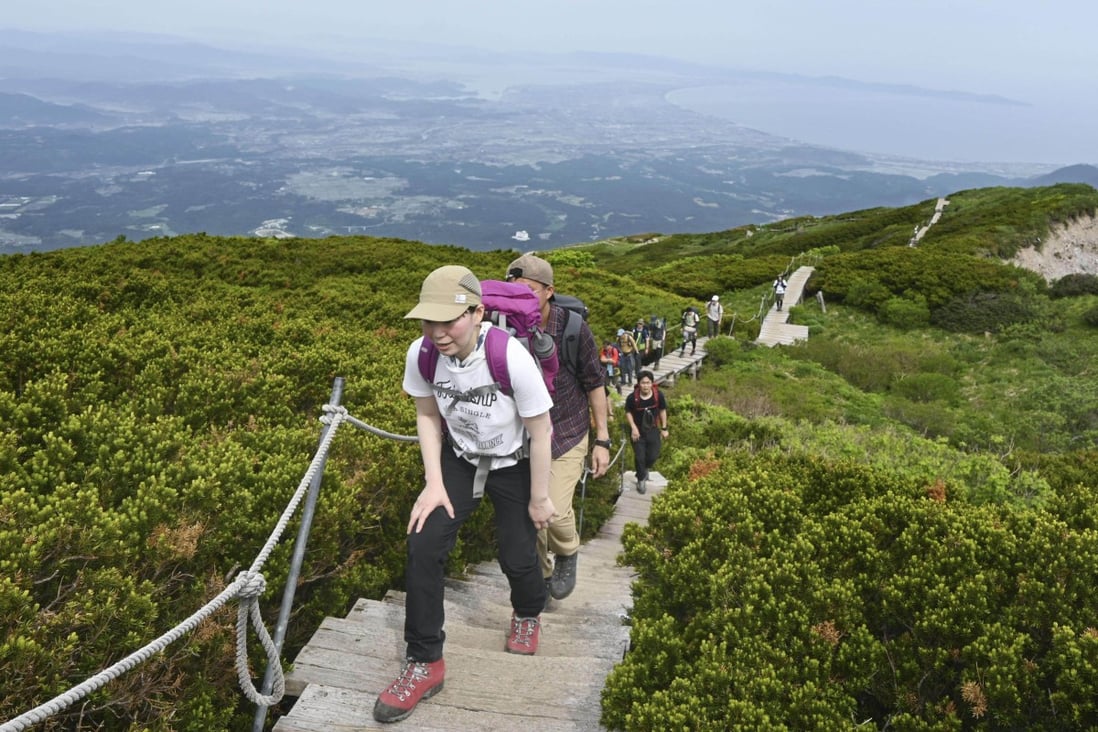 Visitors walk on Mount Daisen in western Japan’s Tottori Prefecture on June 5. The nation is gradually reopening its borders and many tourists are keen to book trips. Photo: Kyodo