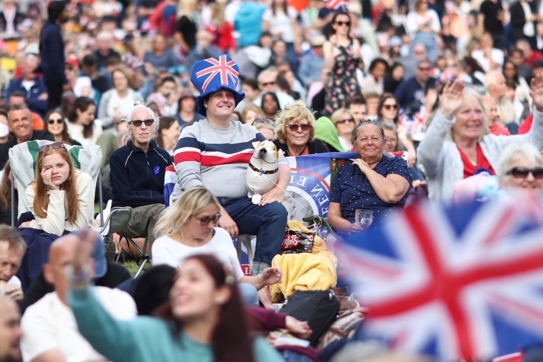 People gather on The Mall ahead of a concert outside Buckingham Palace during Queen Elizabeth’s Platinum Jubilee celebrations in London on June 4. Photo: Reuters