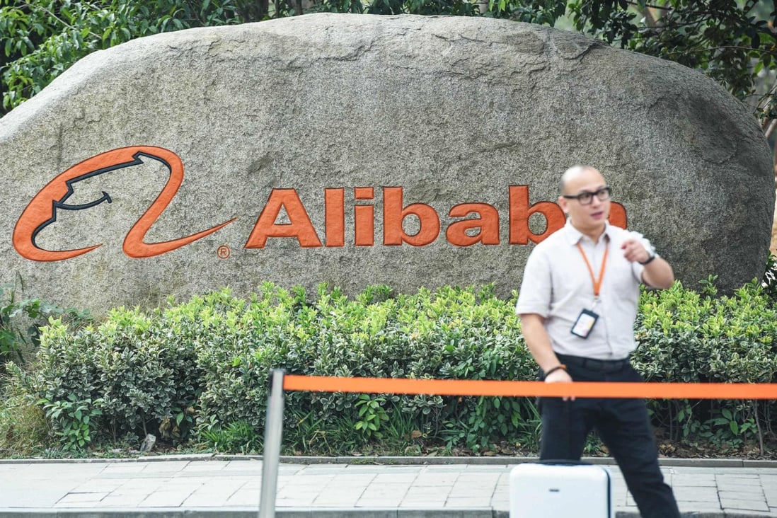 A staff member walks past a logo of Chinese e-commerce giant Alibaba in its headquarters in Hangzhou in China’s eastern Zhejiang province on May 27. Photo: AFP