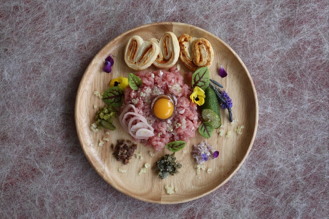 Veal tartare with pickled shallots, Parmesan paprika palmiers and finger limes: light, lean and elegant. Photo: Jonathan Wong