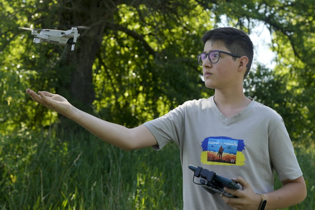 Andriy Pokrasa, 15, lands his drone on his hand. Photo: AP