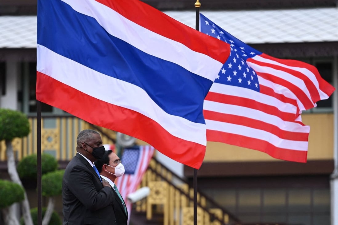US Defence Secretary Lloyd Austin, left, stands at attention beside Thailand’s Prime Minister Prayuth Chan-ocha as they inspect an honour guard at Government House in Bangkok on Monday. Photo: AFP
