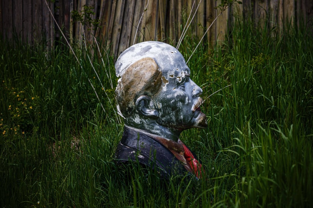 A bust of the founder of the Soviet Union Vladimir Lenin sits in a forest inside the Chernobyl Exclusion Zone on May 29, amid the Russian invasion of Ukraine. Any chances of the Ukraine war growing into a nuclear conflict must be snuffed out. Photo: AFP