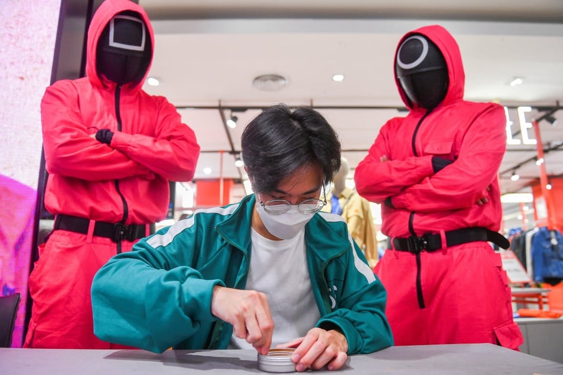 A man takes part in a “Squid Game” mission at a department store in Bangkok, Thailand in November 2021. Photo: Reuters
