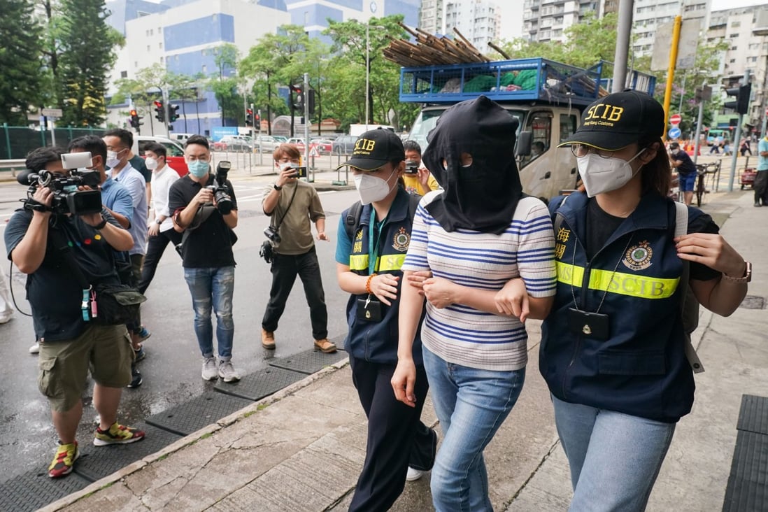 Customs officers arrest a woman in Jordan for allegedly laundering more than HK$350 million in suspected criminal proceeds. Photo: Felix Wong