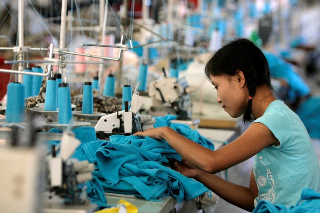 A Myanmar migrant works in a Taiwanese-owned garment factory in Thailand. Photo: Reuters