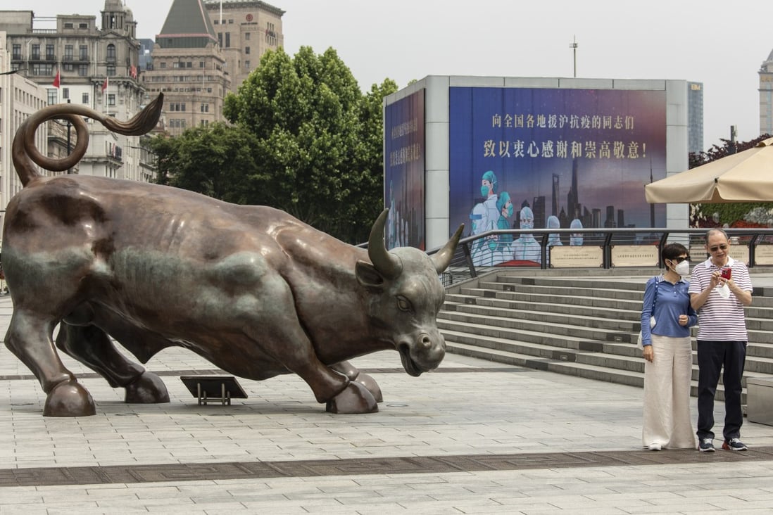 The Bund Bull statue and a screen displaying a thank you message for healthcare workers in Shanghai on June 1 as the city emerges from a lockdown. Photo: Bloomberg