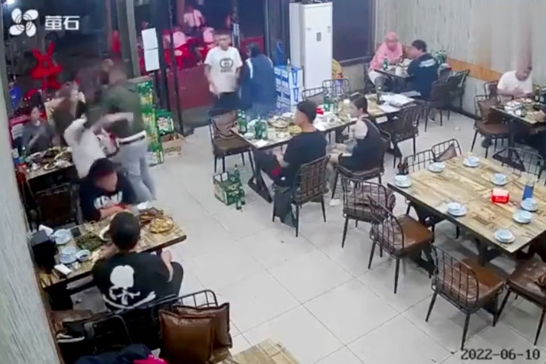 A man assaults a woman at a restaurant in the northeastern Chinese city of Tangshan in this image taken from surveillance footage. Photo: Reuters