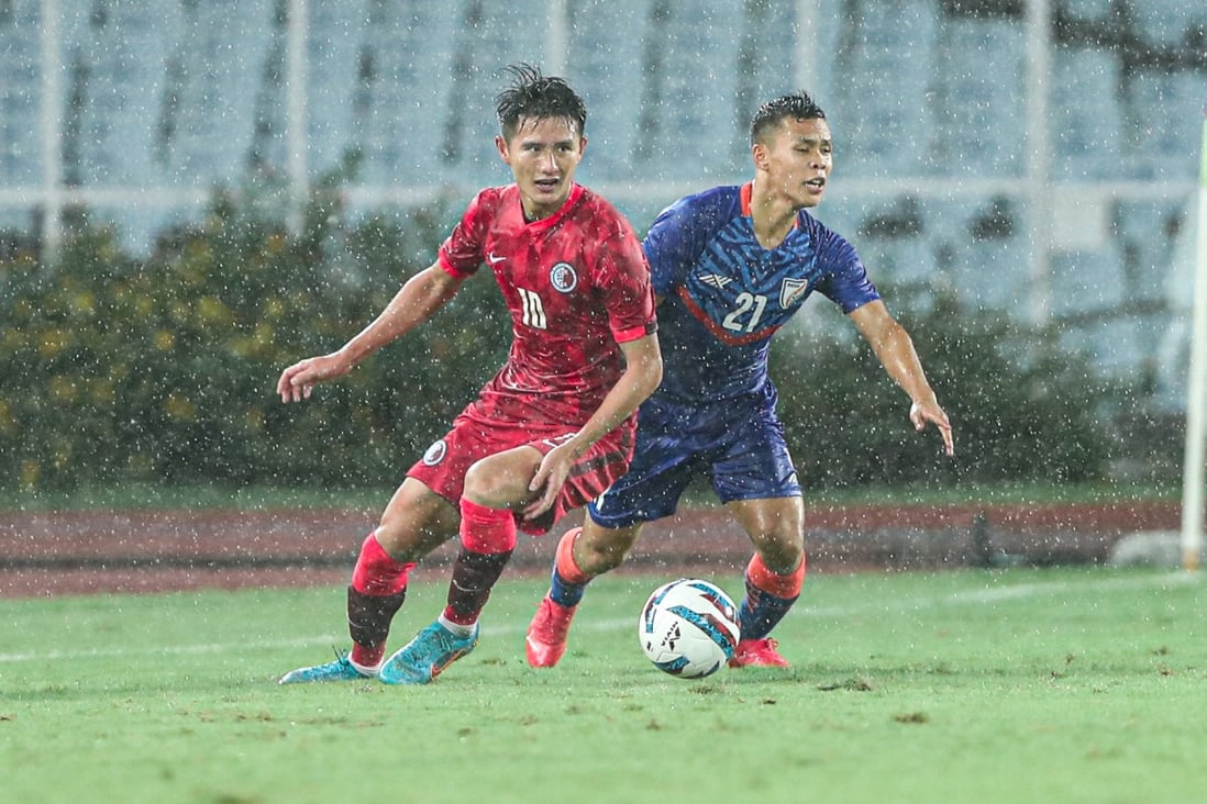 Hong Kong’s Wong Wai (left) and India midfielder Suresh Sing Wangjam battle for the ball at Salt Lake Stadium in Kolkata, India, during their last Group D Asian Cup qualifier. Photo: HKFA