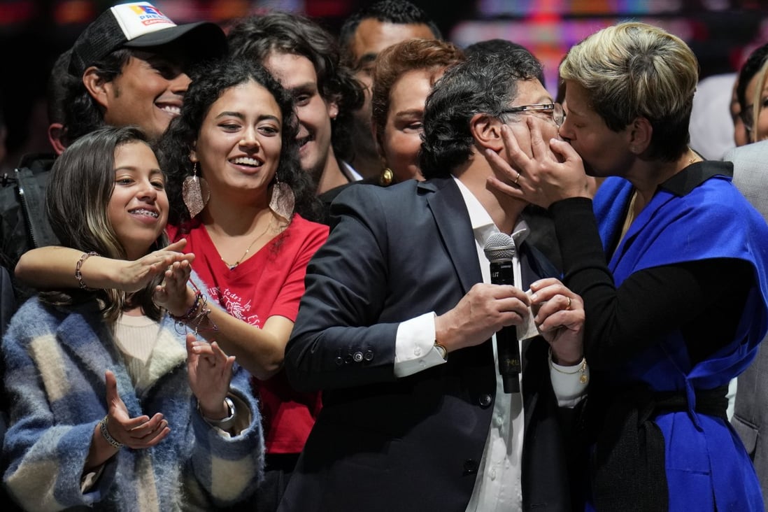 Veronica Alcocer kisses her husband, President elect Gustavo Petro, as they celebrate with supporters in Bogota, Colombia. Photo: AP