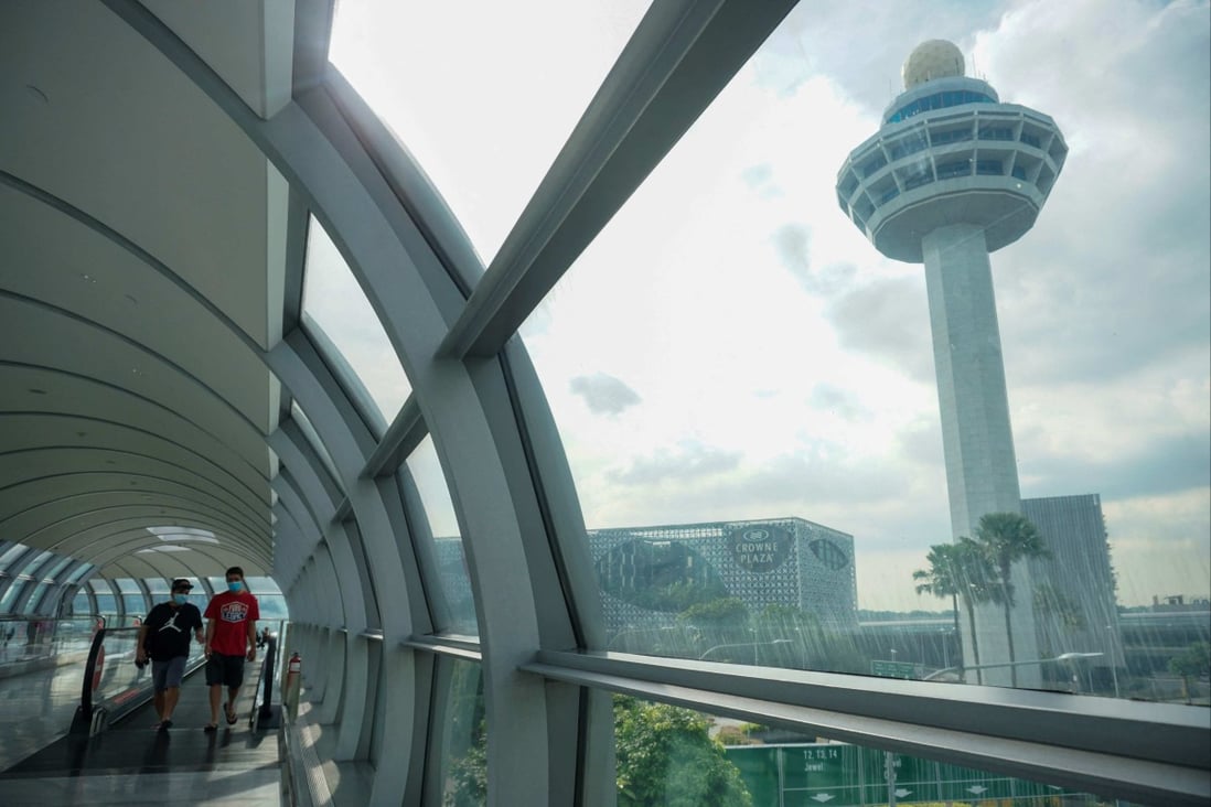 People walk at Changi International Airport in Singapore In November 2021. Photo: AFP