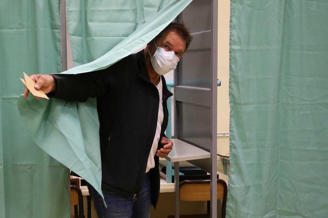 A voter wears a mask as cases of Covid-19 variants are on the rise in France. Photo: AP 