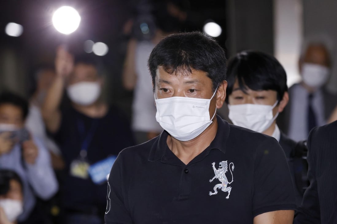 Japanese suspect Mitsuhiro Taniguchi  arrives at Narita International Airport east of Tokyo. Photo: AP