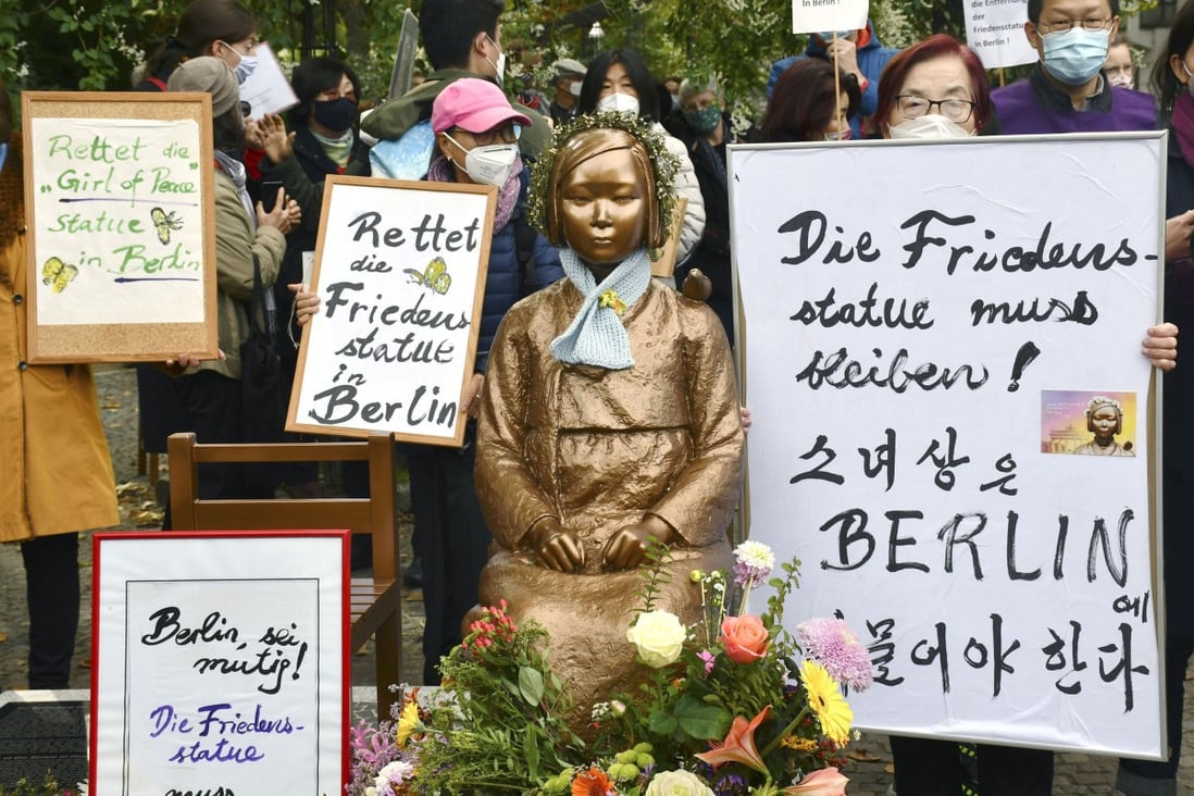 People gather around a statue symbolising Korean “comfort women” made to work in Japanese wartime military brothels, in Berlin in 2020, in protest against the German city’s decision to rescind approval for it to stand there. The authorities later changed their stance and the statue is still in place. Photo: Kyodo