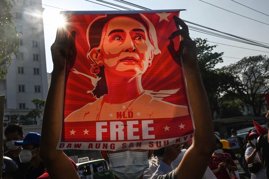 A protester holds up a poster featuring Aung San Suu Kyi during a demonstration in Yangon in 2021. File photo: AFP