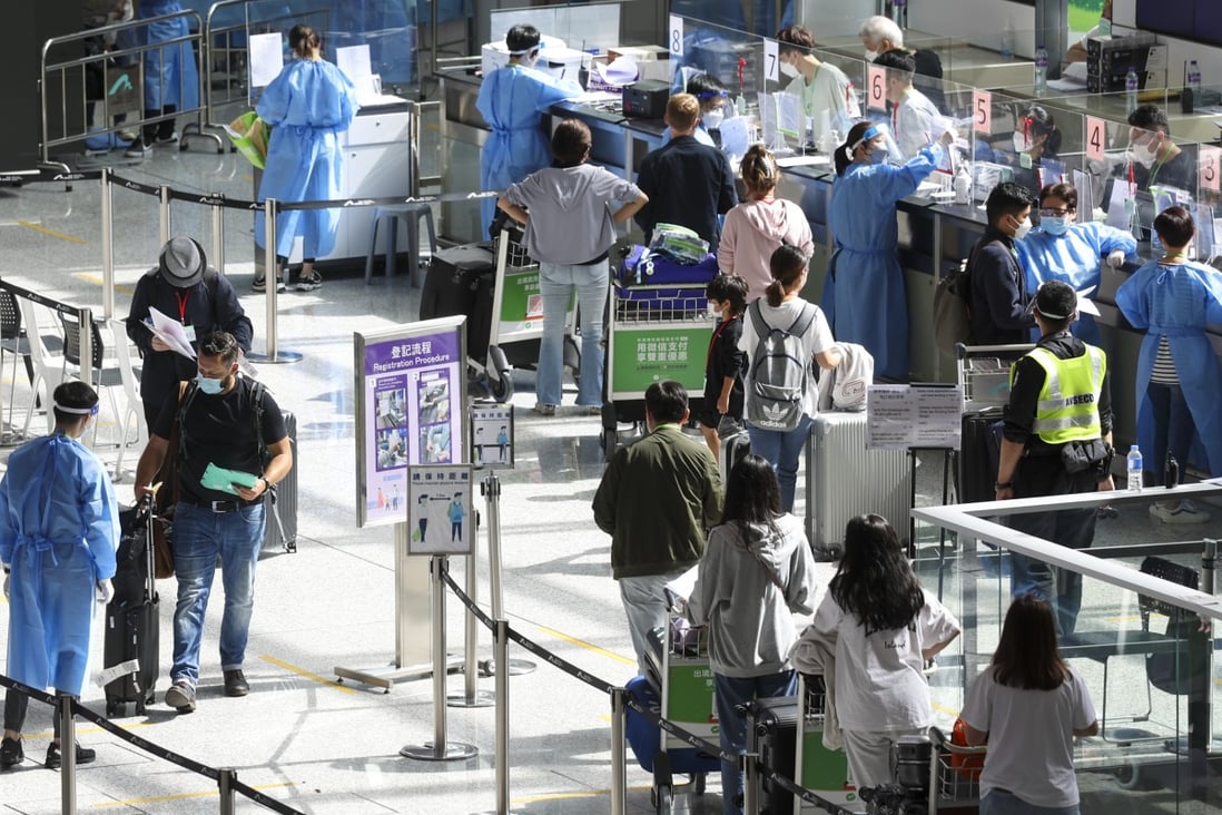 Travellers at Hong Kong International Airport wait to be transported to their quarantine facilities. Photo: Yik Yeung-man
