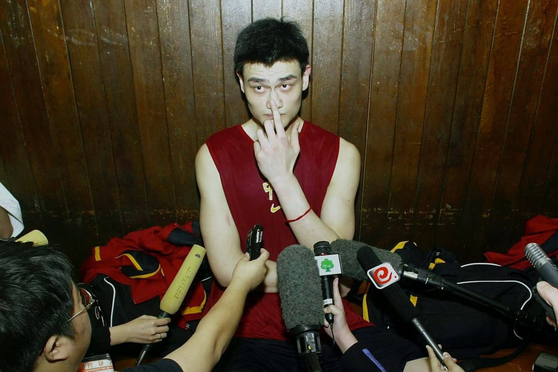 Basketball Hall of Famer Yao Ming speaking with reporters in Beijing circa 2002. Photo: AFP